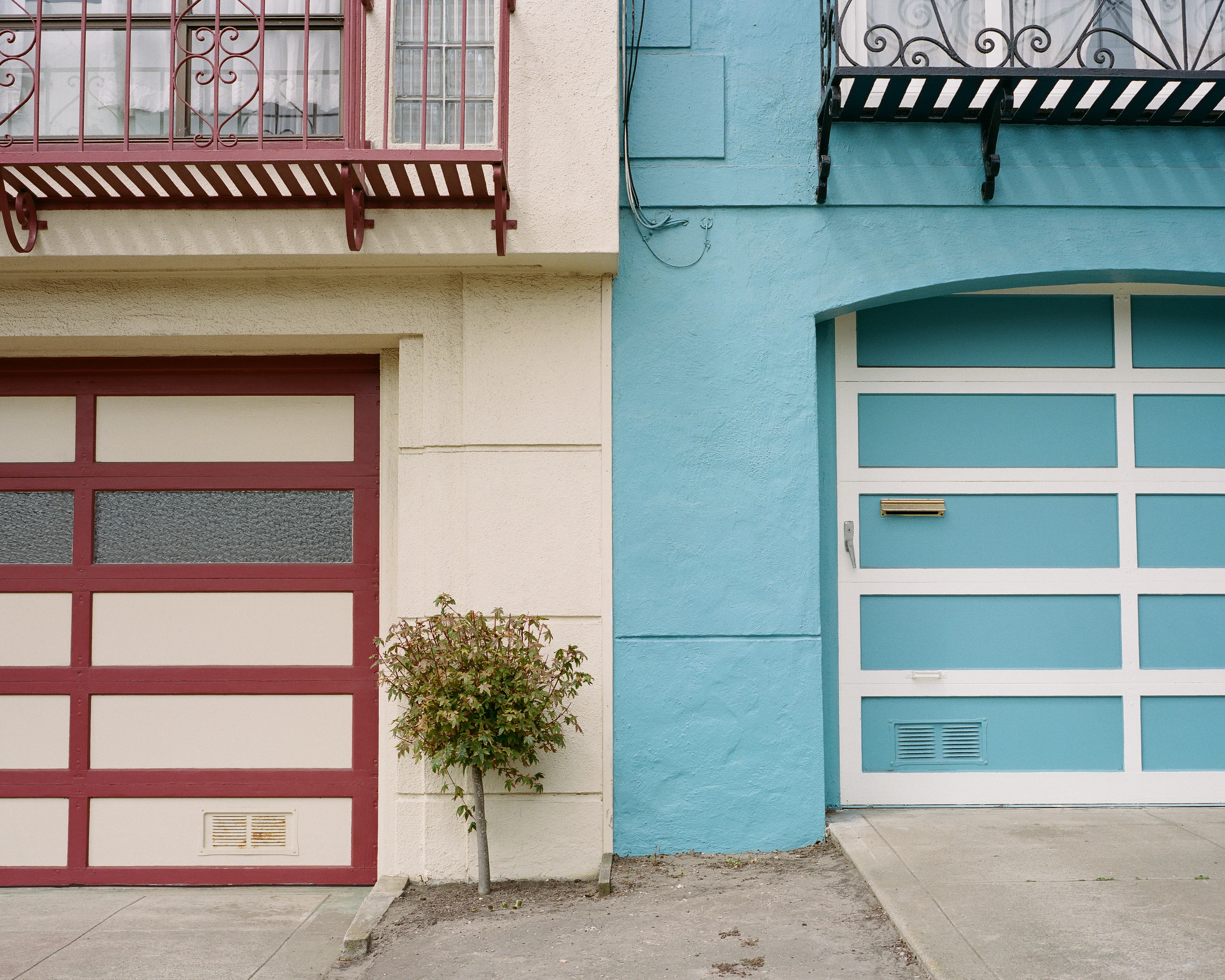 "Outer" is a collection of photographs shot in the Outer Sunset neighborhood of San Francisco, CA. 

Every home in the Outer Sunset has its own unique identity. Although we've likely never met anyone living in these homes, we're able to get a glimpse of their personality through the decorations and color choices of their outer walls.

All photos were shot with a Mamiya 7, using Kodak Portra 400 film stock.