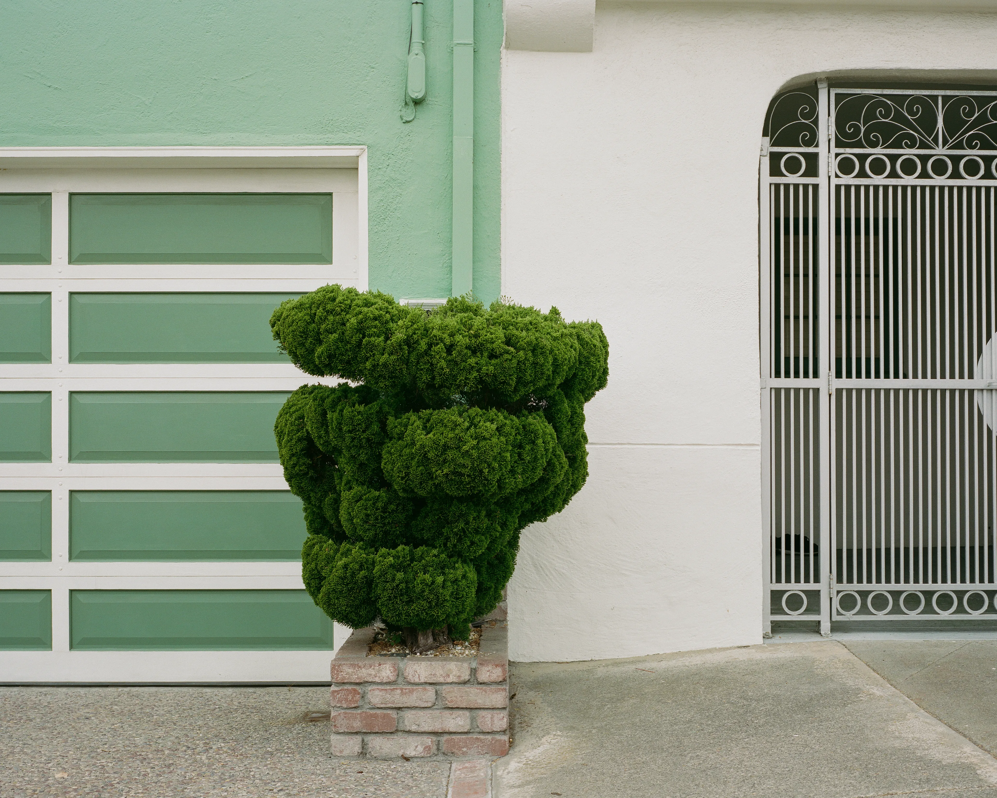 "Outer" is a collection of photographs shot in the Outer Sunset neighborhood of San Francisco, CA. 

Every home in the Outer Sunset has its own unique identity. Although we've likely never met anyone living in these homes, we're able to get a glimpse of their personality through the decorations and color choices of their outer walls.

All photos were shot with a Mamiya 7, using Kodak Portra 400 film stock.