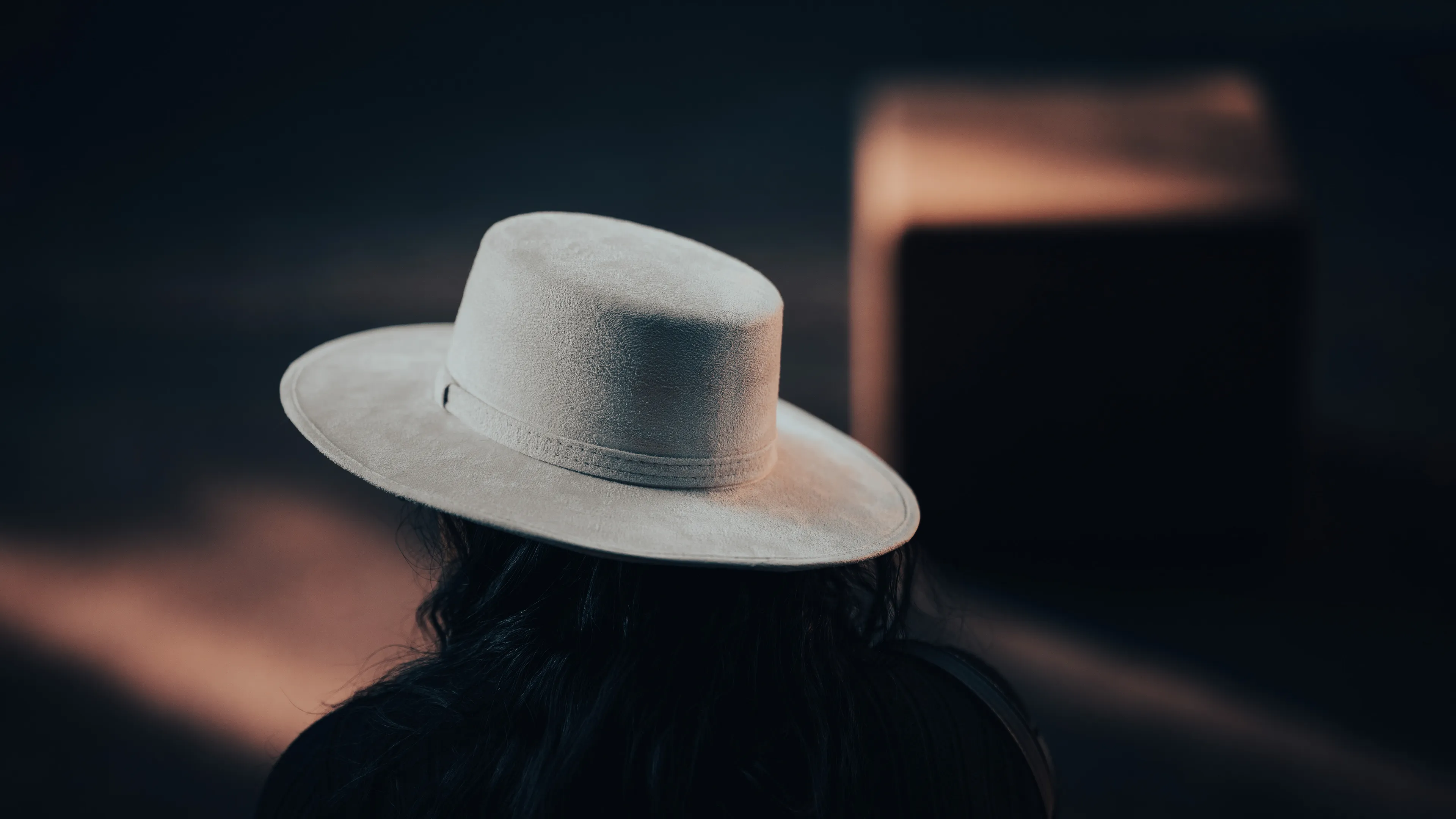 City Hats explores individuality through cinematic street portraits, inspired by my earlier series, City. Framed in 16:9, these photographs center on the backs of strangers wearing hats—highlighting style while leaving identity unseen. Each hat tells a story, echoing Lily Dache's words: "The hat is the expression of who we are, where we're going, and where we've been."

These aren't portraits of fashion, but of gesture, posture, and presence. A hat becomes a shorthand for personality—a quiet declaration of character, intention, or mood. Seen from behind, each figure feels like someone entering a movie scene mid-story—anonymous, yet already alive with narrative.

As the film Arizona Dream reminds us: "Even without pants… you didn't have to be ashamed of your ass as long as you had a hat."