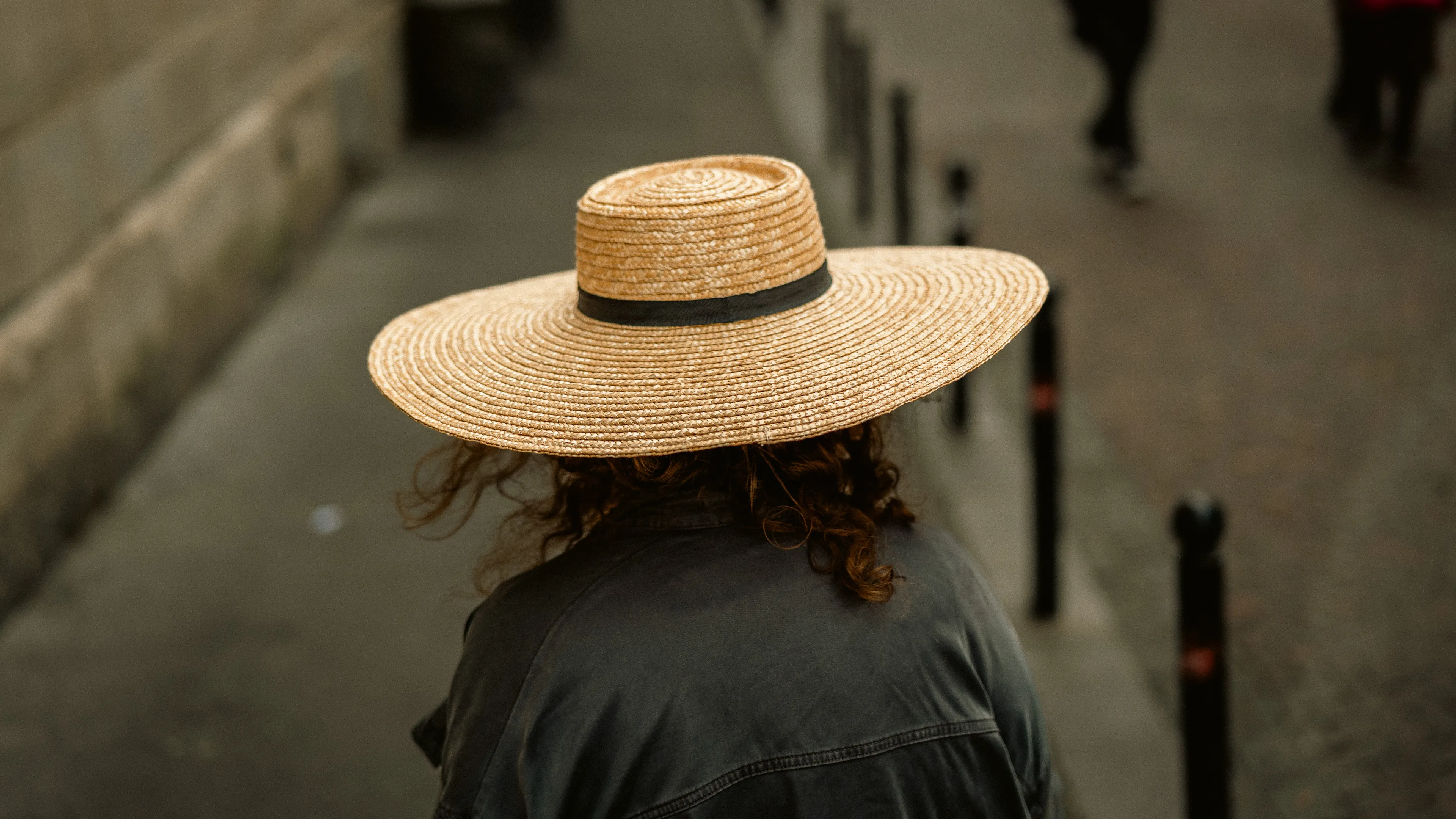 City Hats explores individuality through cinematic street portraits, inspired by my earlier series, City. Framed in 16:9, these photographs center on the backs of strangers wearing hats—highlighting style while leaving identity unseen. Each hat tells a story, echoing Lily Dache's words: "The hat is the expression of who we are, where we're going, and where we've been."

These aren't portraits of fashion, but of gesture, posture, and presence. A hat becomes a shorthand for personality—a quiet declaration of character, intention, or mood. Seen from behind, each figure feels like someone entering a movie scene mid-story—anonymous, yet already alive with narrative.

As the film Arizona Dream reminds us: "Even without pants… you didn't have to be ashamed of your ass as long as you had a hat."