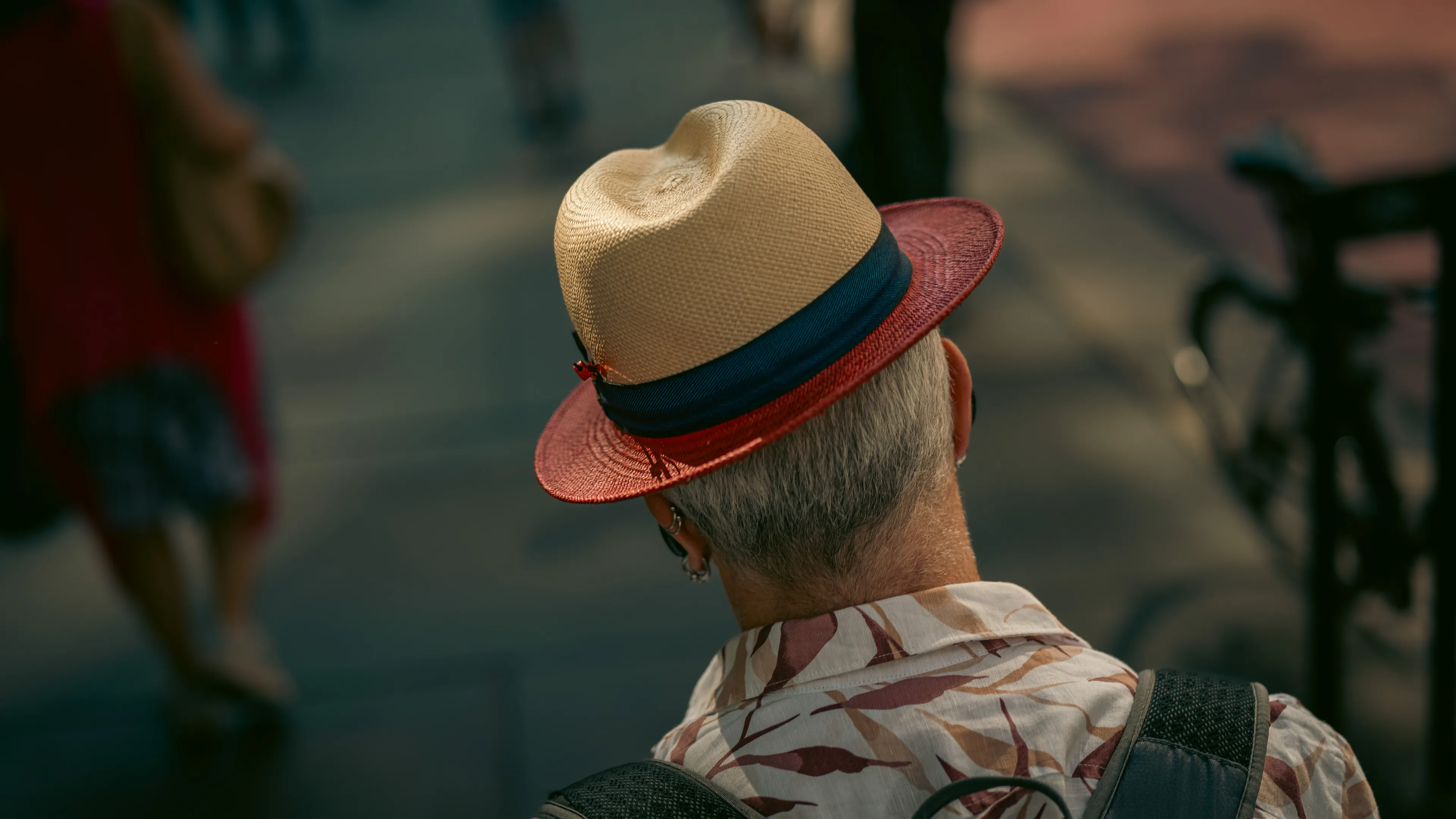 City Hats explores individuality through cinematic street portraits, inspired by my earlier series, City. Framed in 16:9, these photographs center on the backs of strangers wearing hats—highlighting style while leaving identity unseen. Each hat tells a story, echoing Lily Dache's words: "The hat is the expression of who we are, where we're going, and where we've been."

These aren't portraits of fashion, but of gesture, posture, and presence. A hat becomes a shorthand for personality—a quiet declaration of character, intention, or mood. Seen from behind, each figure feels like someone entering a movie scene mid-story—anonymous, yet already alive with narrative.

As the film Arizona Dream reminds us: "Even without pants… you didn't have to be ashamed of your ass as long as you had a hat."