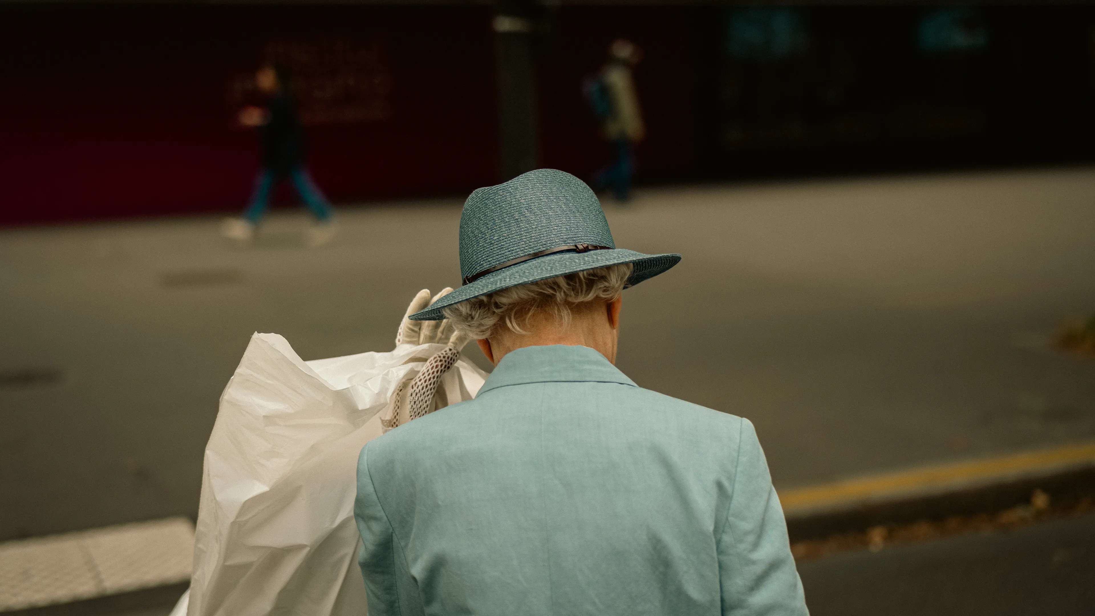 City Hats explores individuality through cinematic street portraits, inspired by my earlier series, City. Framed in 16:9, these photographs center on the backs of strangers wearing hats—highlighting style while leaving identity unseen. Each hat tells a story, echoing Lily Dache's words: "The hat is the expression of who we are, where we're going, and where we've been."

These aren't portraits of fashion, but of gesture, posture, and presence. A hat becomes a shorthand for personality—a quiet declaration of character, intention, or mood. Seen from behind, each figure feels like someone entering a movie scene mid-story—anonymous, yet already alive with narrative.

As the film Arizona Dream reminds us: "Even without pants… you didn't have to be ashamed of your ass as long as you had a hat."