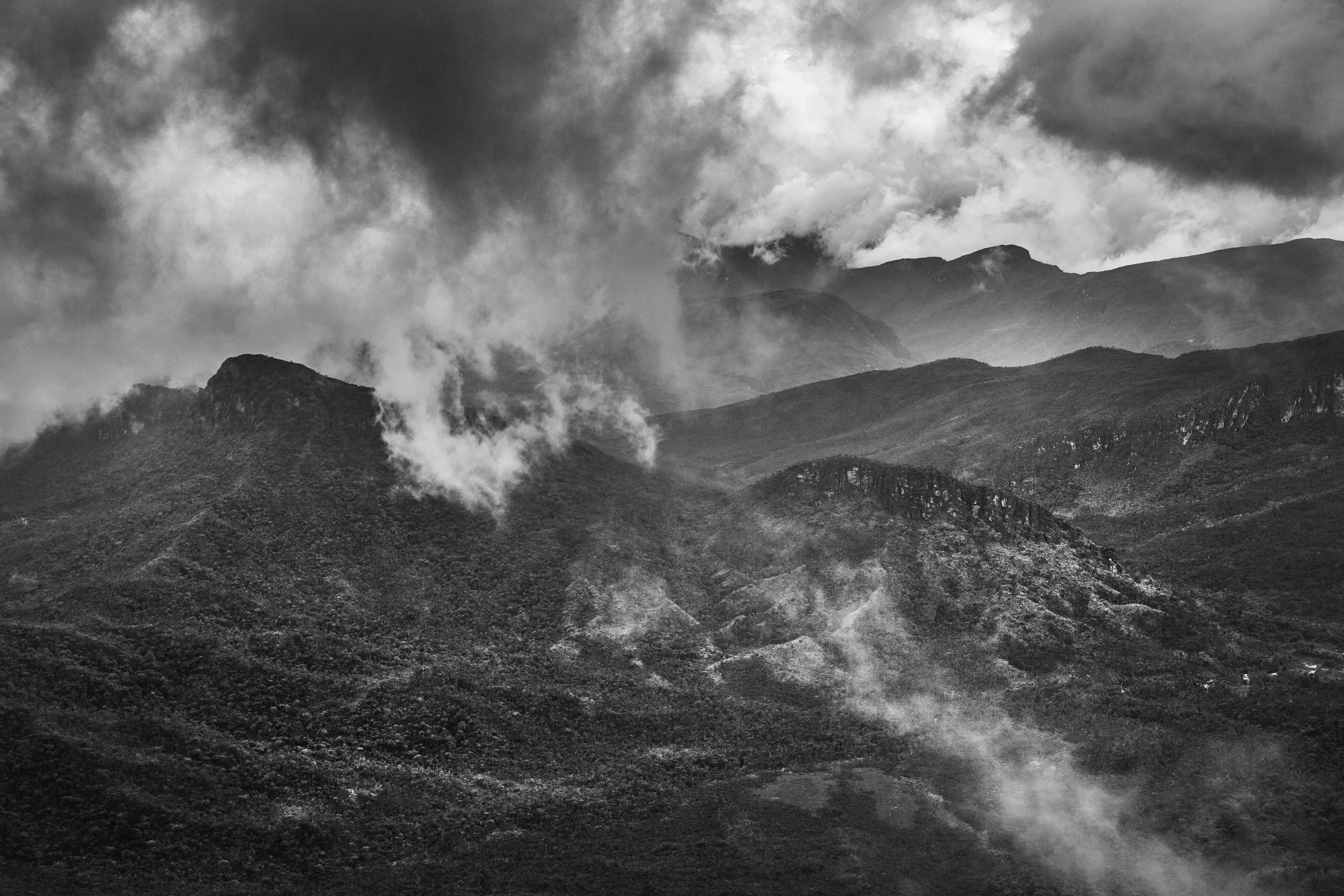 Pico da Neblina National Park, the Imeri range, State of Amazonas, Brazil, 2014

The mountain range that defines the life of the Amazon basin lies far to the west of Brazil. But if the Andes provides most of the water that flows through hundreds of tributaries into the Amazon River, Brazil too can boast mountains. To the southeast lie the Brazilian Highlands, which include the mineral rich state of Minas Gerais. Heading north towards the heart of the rainforest, the landscape remains undulating, with a hilltop known as Serra Pelada in the state of Pará drawing one of the country's biggest-ever gold rushes in the 1980s. Even closer to the Amazon River, occasional large rock formations appear like intruders into the quiet order of the lowlands.