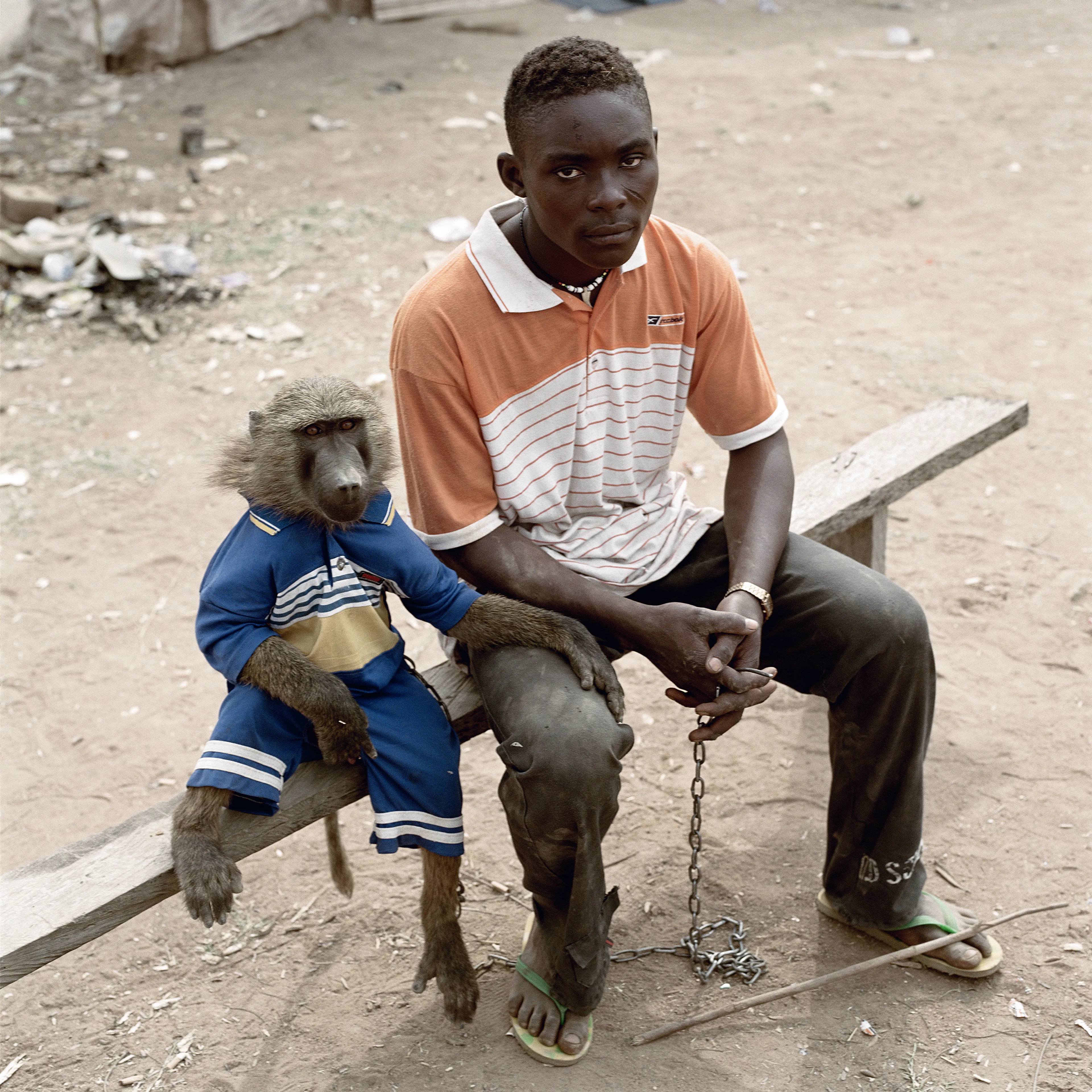 Pieter Hugo’s The Hyena and Other Men (2005-2007) is a portrait series produced in Nigeria about a community of ‘hyena men’ who together form a community around the ownership of exotic animals, predominantly hyenas, but pythons and monkeys as well. Dubbed the “Gadawan Kura” (which roughly translates from Hausa to “hyena handlers”), these men make a living by capturing, training, and performing with these animals.

Edition: 1 of 1