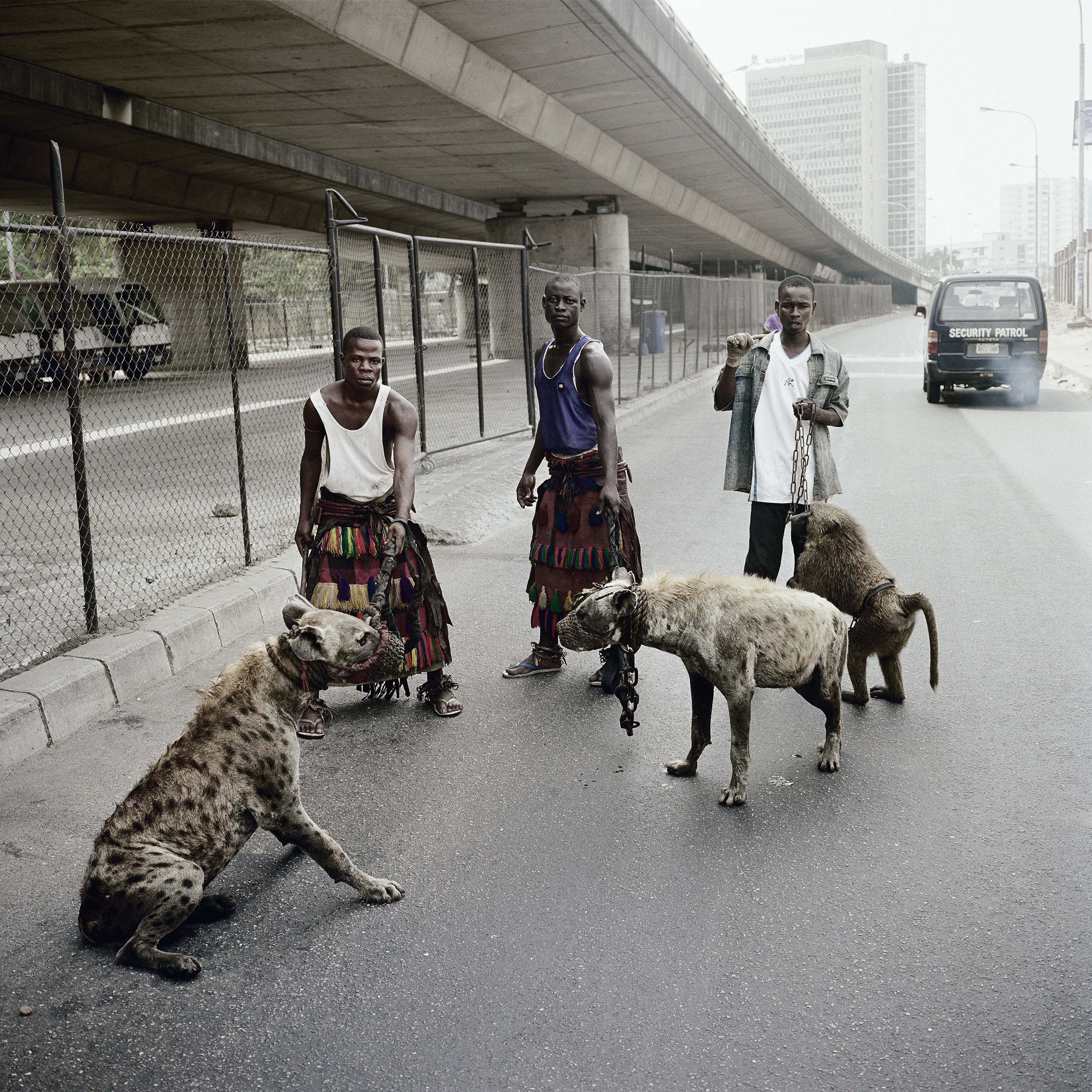 Pieter Hugo’s The Hyena and Other Men (2005-2007) is a portrait series produced in Nigeria about a community of ‘hyena men’ who together form a community around the ownership of exotic animals, predominantly hyenas, but pythons and monkeys as well. Dubbed the “Gadawan Kura” (which roughly translates from Hausa to “hyena handlers”), these men make a living by capturing, training, and performing with these animals.

Edition: 1 of 1