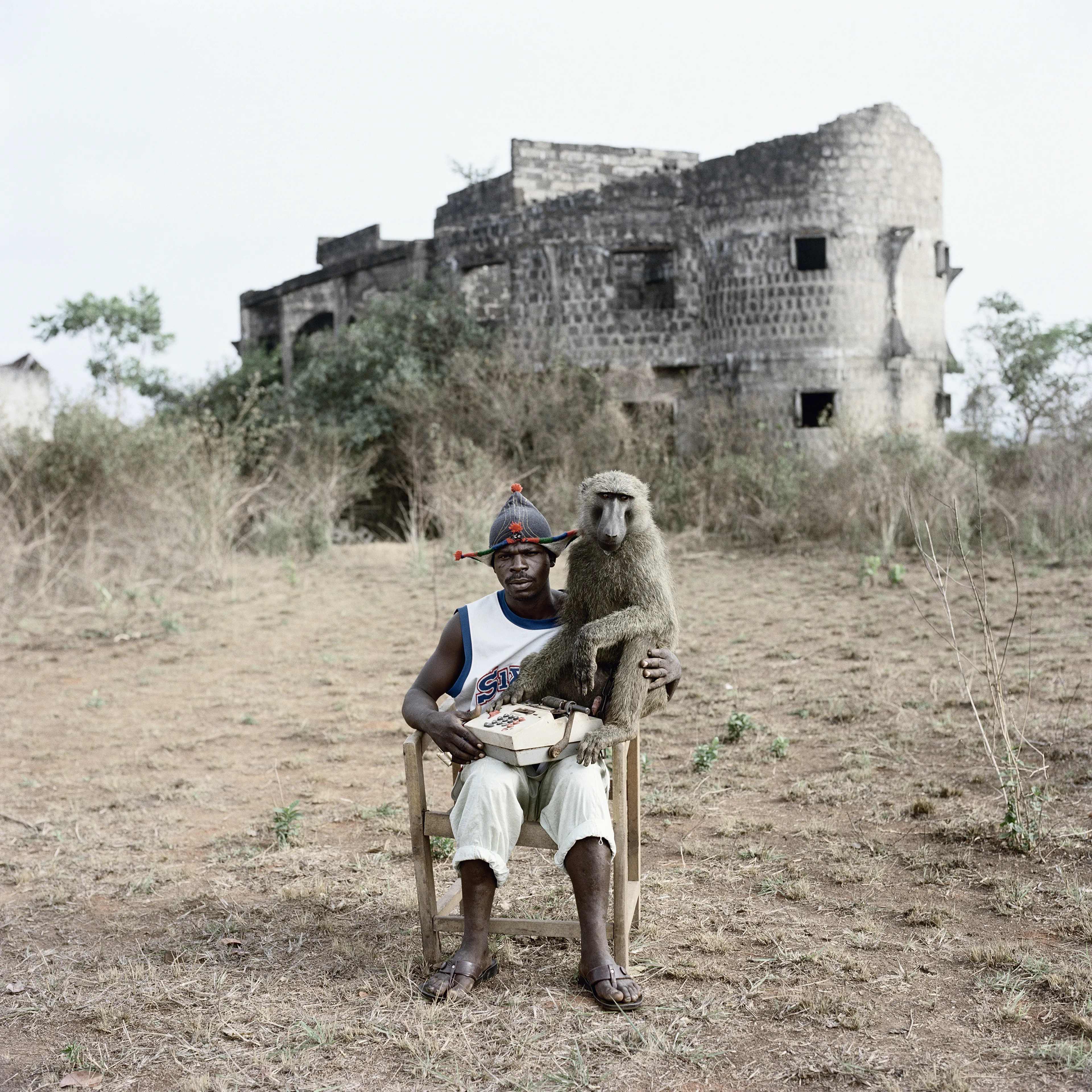 Pieter Hugo’s The Hyena and Other Men (2005-2007) is a portrait series produced in Nigeria about a community of ‘hyena men’ who together form a community around the ownership of exotic animals, predominantly hyenas, but pythons and monkeys as well. Dubbed the “Gadawan Kura” (which roughly translates from Hausa to “hyena handlers”), these men make a living by capturing, training, and performing with these animals.

Edition: 1 of 1