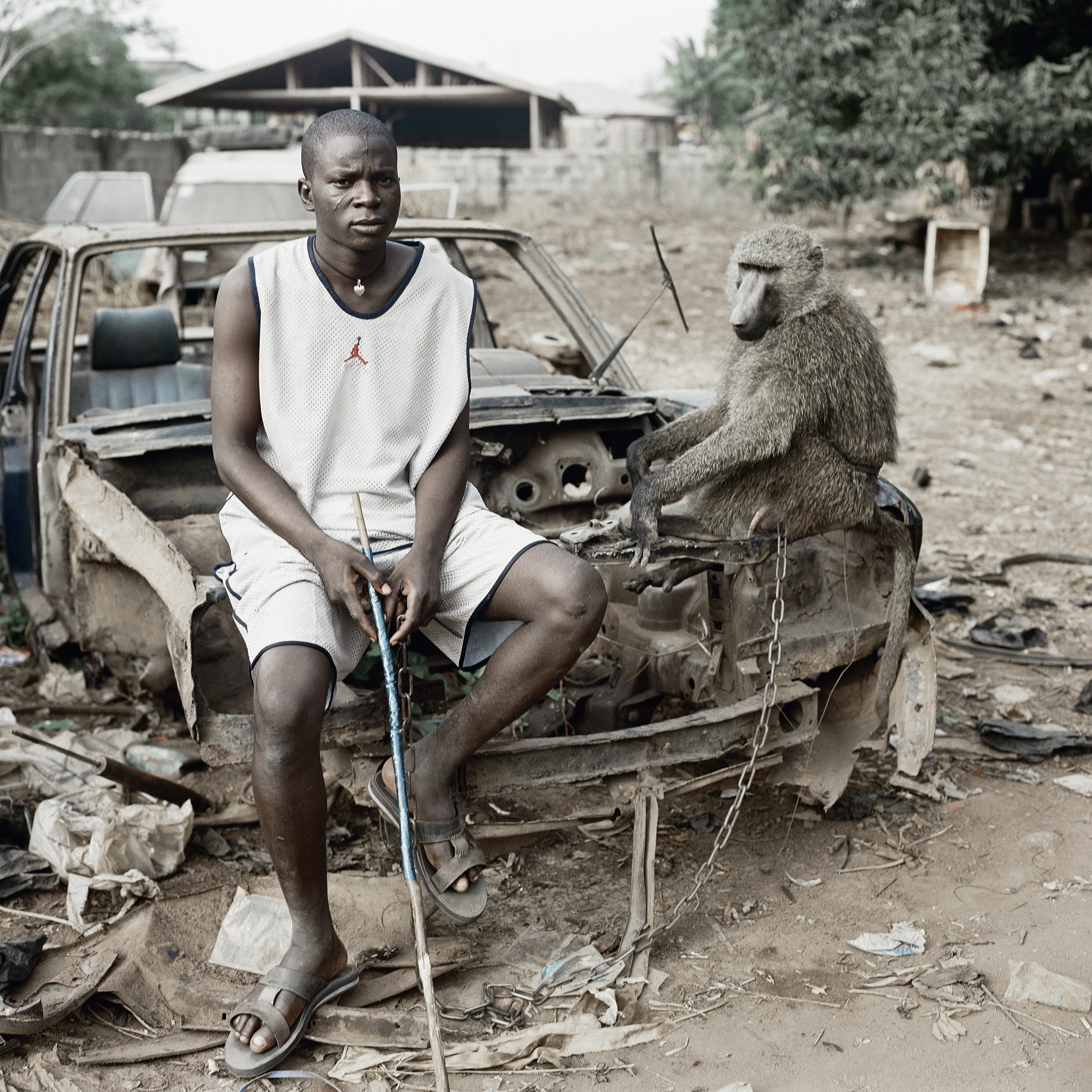 Pieter Hugo’s The Hyena and Other Men (2005-2007) is a portrait series produced in Nigeria about a community of ‘hyena men’ who together form a community around the ownership of exotic animals, predominantly hyenas, but pythons and monkeys as well. Dubbed the “Gadawan Kura” (which roughly translates from Hausa to “hyena handlers”), these men make a living by capturing, training, and performing with these animals.

Edition: 1 of 1