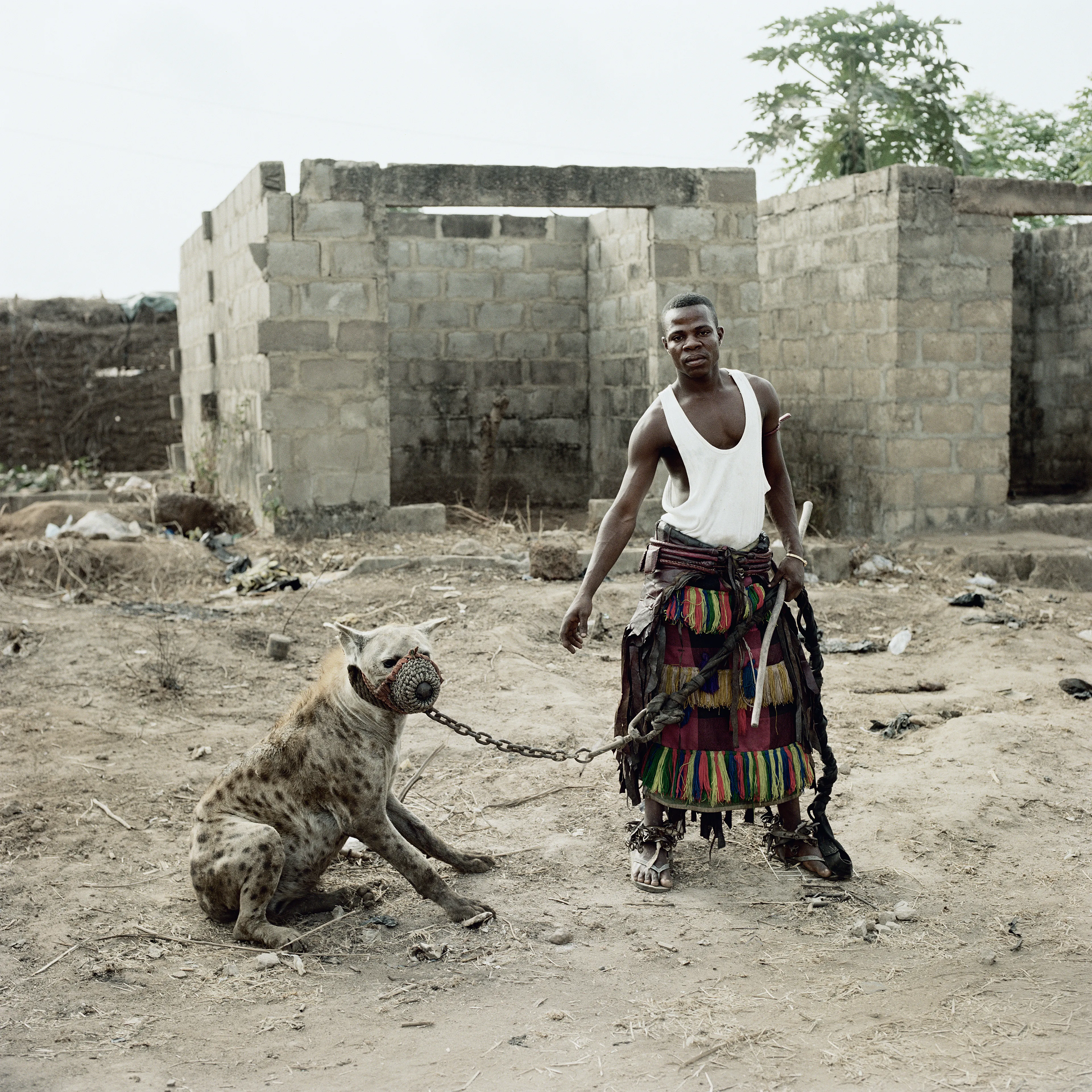 Pieter Hugo’s The Hyena and Other Men (2005-2007) is a portrait series produced in Nigeria about a community of ‘hyena men’ who together form a community around the ownership of exotic animals, predominantly hyenas, but pythons and monkeys as well. Dubbed the “Gadawan Kura” (which roughly translates from Hausa to “hyena handlers”), these men make a living by capturing, training, and performing with these animals.

Edition: 1 of 1