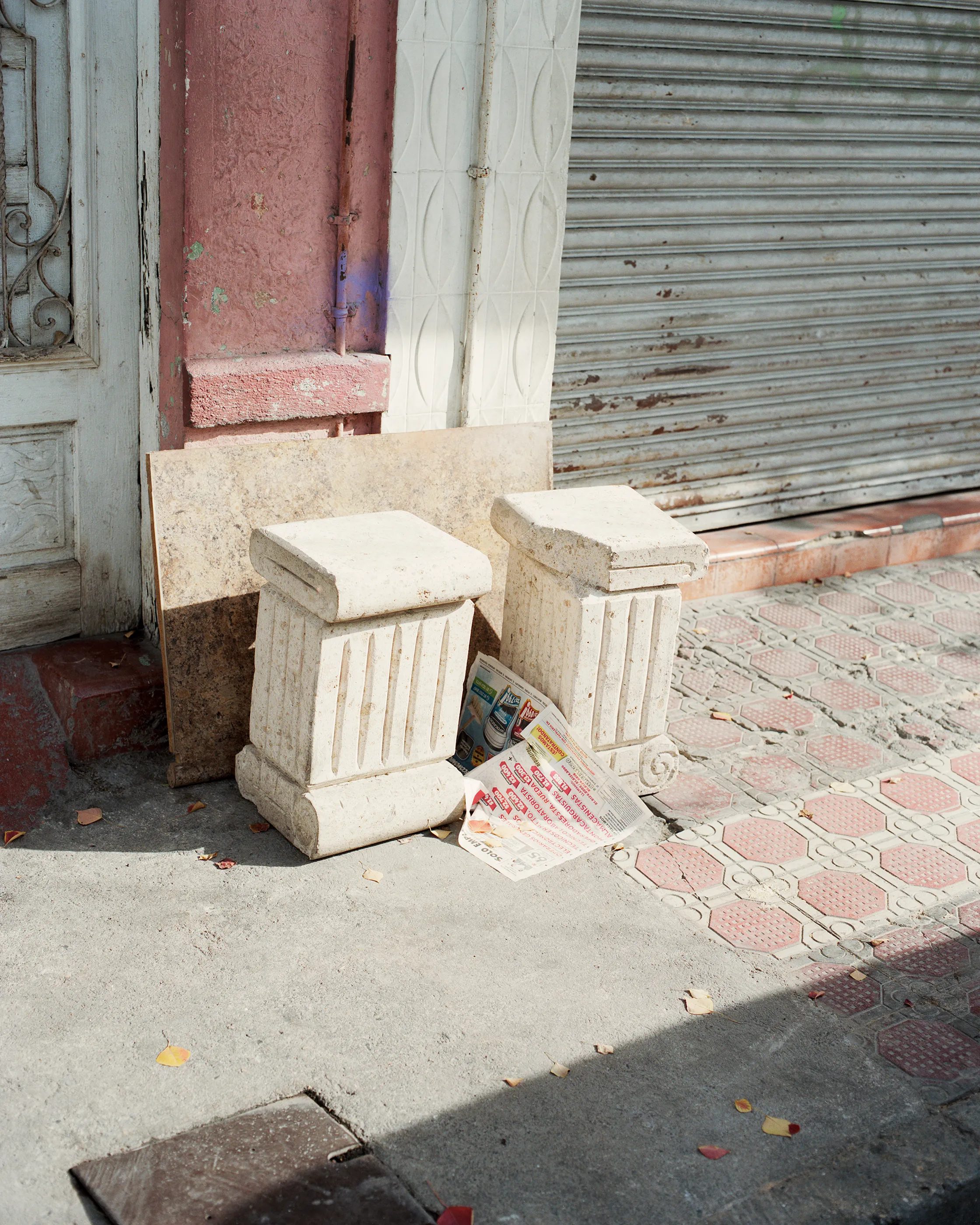 The Infinite Corridor was made in a series of long walks through the sunny streets of northern Mexico. 

Photographed in a chaotic, fragmented style, I hope this collection feels as uncomfortable as it is to walk through the streets of these cities.