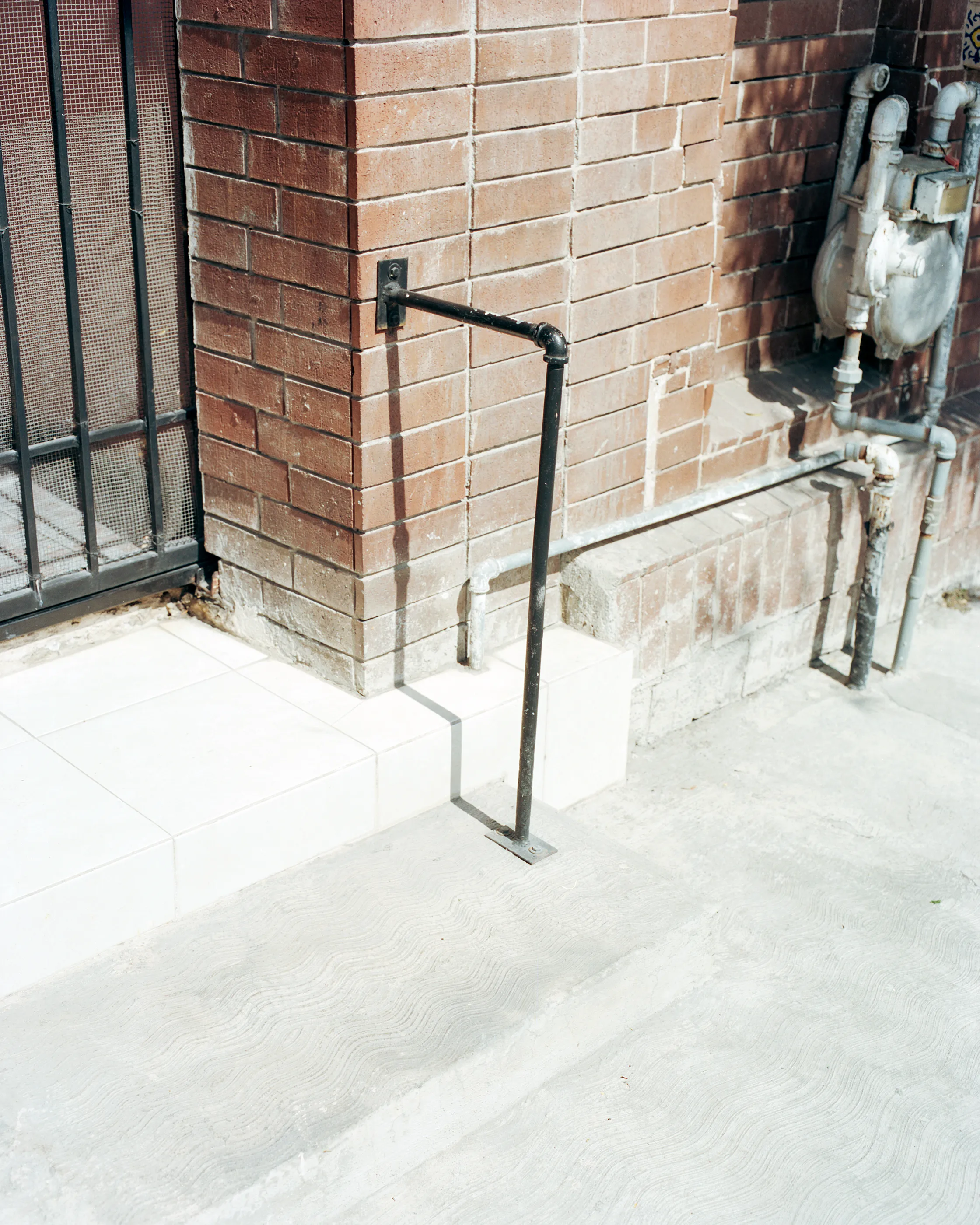 The Infinite Corridor was made in a series of long walks through the sunny streets of northern Mexico. 

Photographed in a chaotic, fragmented style, I hope this collection feels as uncomfortable as it is to walk through the streets of these cities.