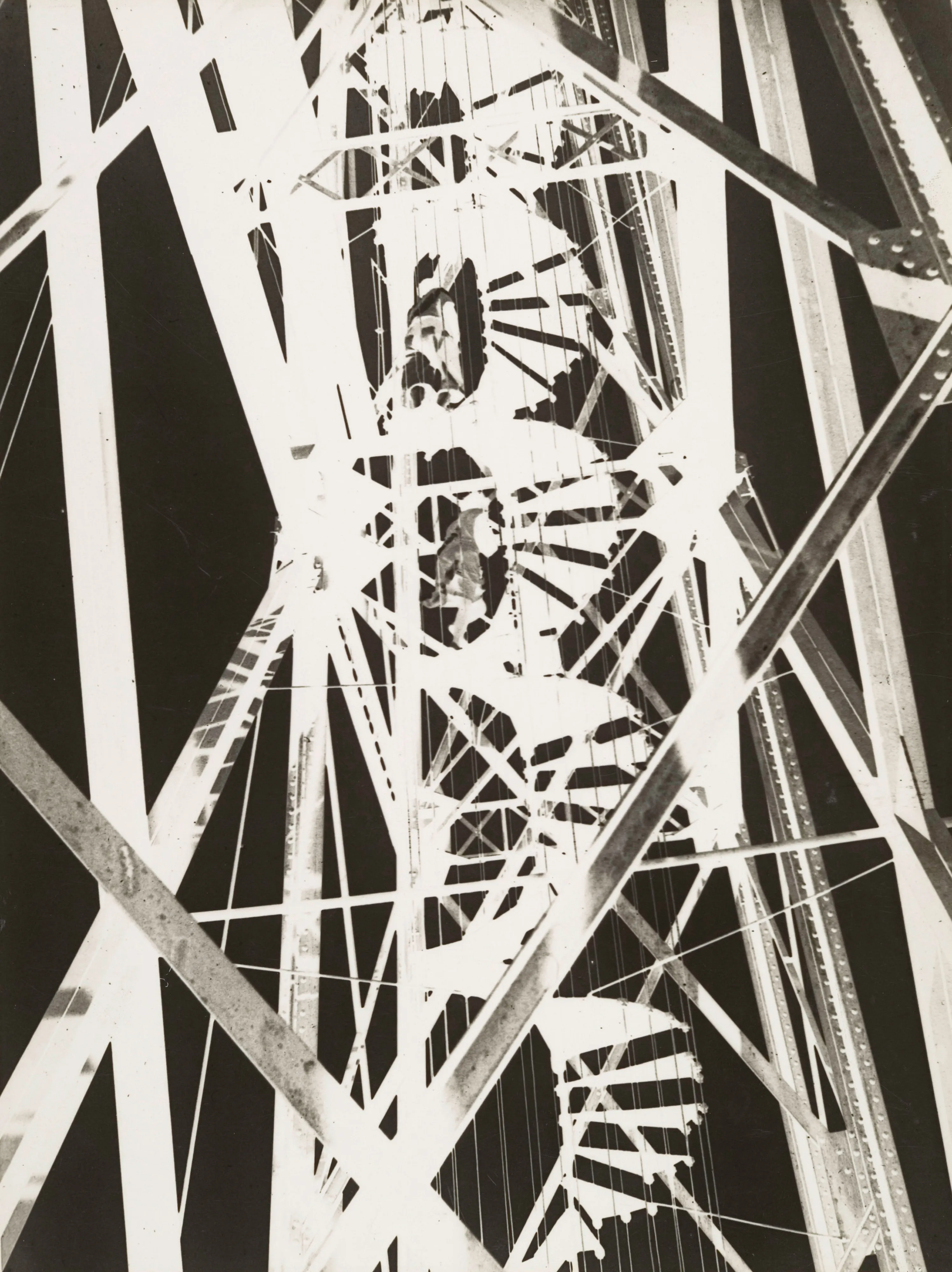 Bauhaus Photography.

In 1929 Moholy-Nagy traveled to Marseilles, where he photographed the Pont Transbordeur, a steel transporter bridge that was celebrated, like the Eiffel Tower, as an icon of modern construction. Like a number of other avant-garde photographers, including Germaine Krull, Herbert Bayer, and Florence Henri, Moholy-Nagy was fascinated by the dynamic spatial relations of the bridge's crisscrossing steel girders and open spiral staircase. In this photograph, he used the technique of reverse printing to create a bold graphic composition that simultaneously clarifies and transforms the structure of the bridge.

The legacy of Hungarian artist Laszlo Moholy-Nagy is among the most cherished in the lineage of photographic art, and he can be defined as a visionary whose radical experiments with photography entirely re-imagined the possibilities for the medium. Working in the early 20th century when photography was not considered a form of high art, Moholy-Nagy actively sought to break down boundaries and find new languages of photographic discourse. In doing so, he left behind an oeuvre of visual ideas that have provided artistic license to a century’s worth of photographers to experiment boldly beyond the conventional definitions of what photography is expected to be.

Edition: 1 of 1