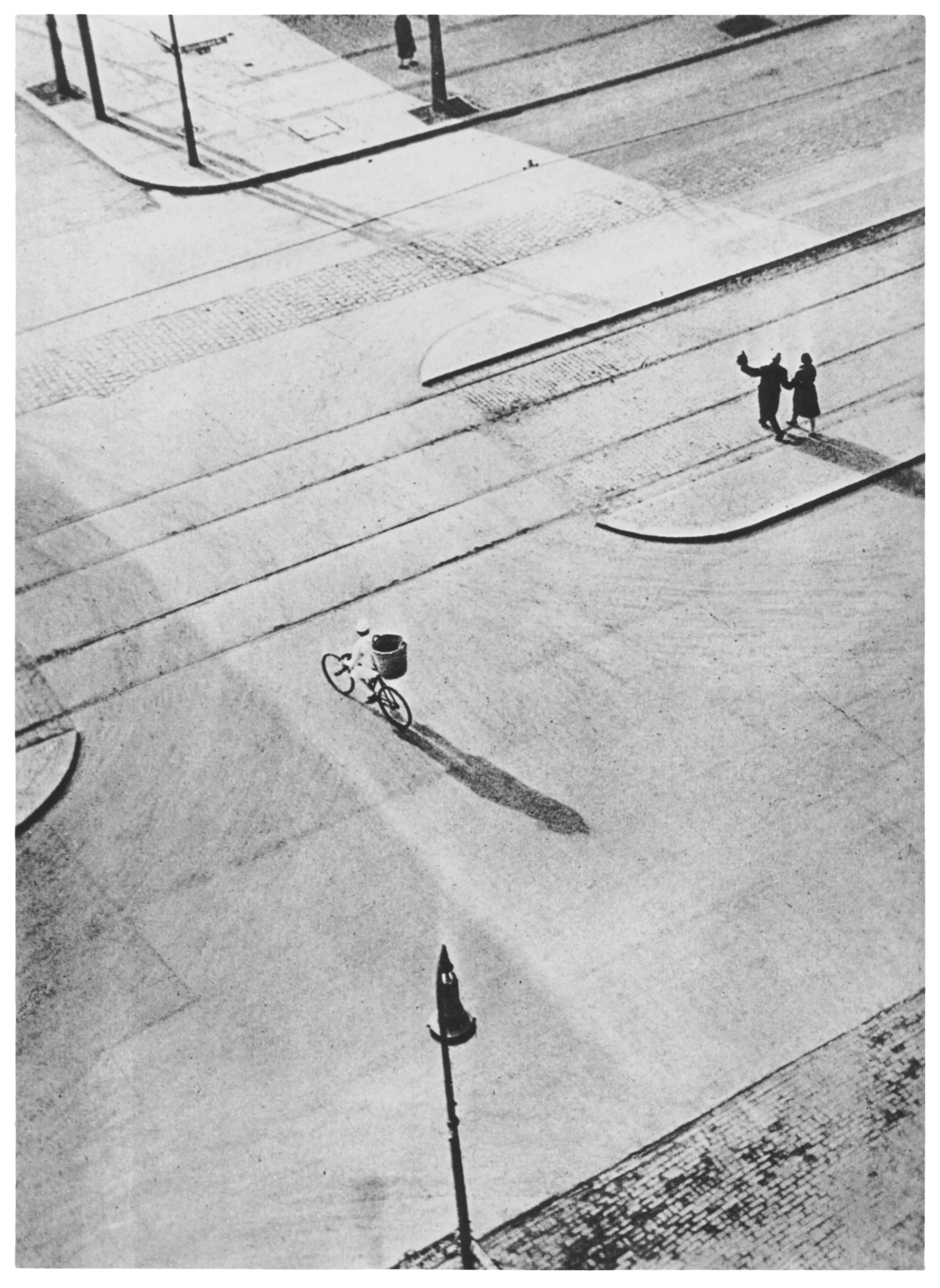 Bauhaus Photography.

Taken from the window of Moholy's home in Berlin. This iconic photograph by Moholy-Nagy shows his experimentation with purely formal aspects such as birds-eye view and strong diagonal lines emulating many of his paintings.

The legacy of Hungarian artist Laszlo Moholy-Nagy is among the most cherished in the lineage of photographic art, and he can be defined as a visionary whose radical experiments with photography entirely re-imagined the possibilities for the medium. Working in the early 20th century when photography was not considered a form of high art, Moholy-Nagy actively sought to break down boundaries and find new languages of photographic discourse. In doing so, he left behind an oeuvre of visual ideas that have provided artistic license to a century’s worth of photographers to experiment boldly beyond the conventional definitions of what photography is expected to be.

Edition: 1 of 1