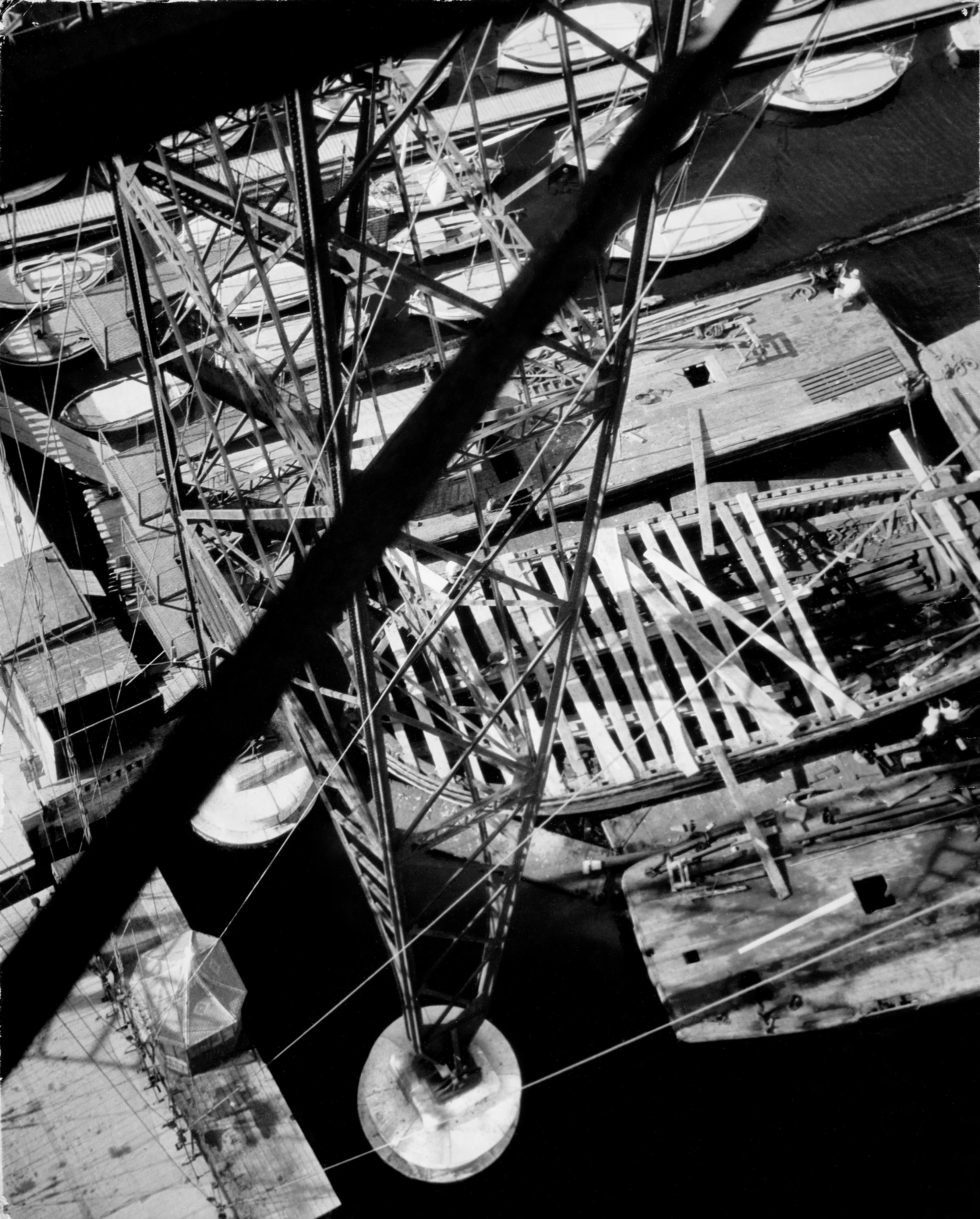 Bauhaus Photography.

In 1929 Moholy-Nagy traveled to Marseilles, where he photographed the Pont Transbordeur, a steel transporter bridge that was celebrated, like the Eiffel Tower, as an icon of modern construction. Like a number of other avant-garde photographers, including Germaine Krull, Herbert Bayer, and Florence Henri, Moholy-Nagy was fascinated by the dynamic spatial relations of the bridge's crisscrossing steel girders and open spiral staircase.

The legacy of Hungarian artist Laszlo Moholy-Nagy is among the most cherished in the lineage of photographic art, and he can be defined as a visionary whose radical experiments with photography entirely re-imagined the possibilities for the medium. Working in the early 20th century when photography was not considered a form of high art, Moholy-Nagy actively sought to break down boundaries and find new languages of photographic discourse. In doing so, he left behind an oeuvre of visual ideas that have provided artistic license to a century’s worth of photographers to experiment boldly beyond the conventional definitions of what photography is expected to be.

Edition: 1 of 1