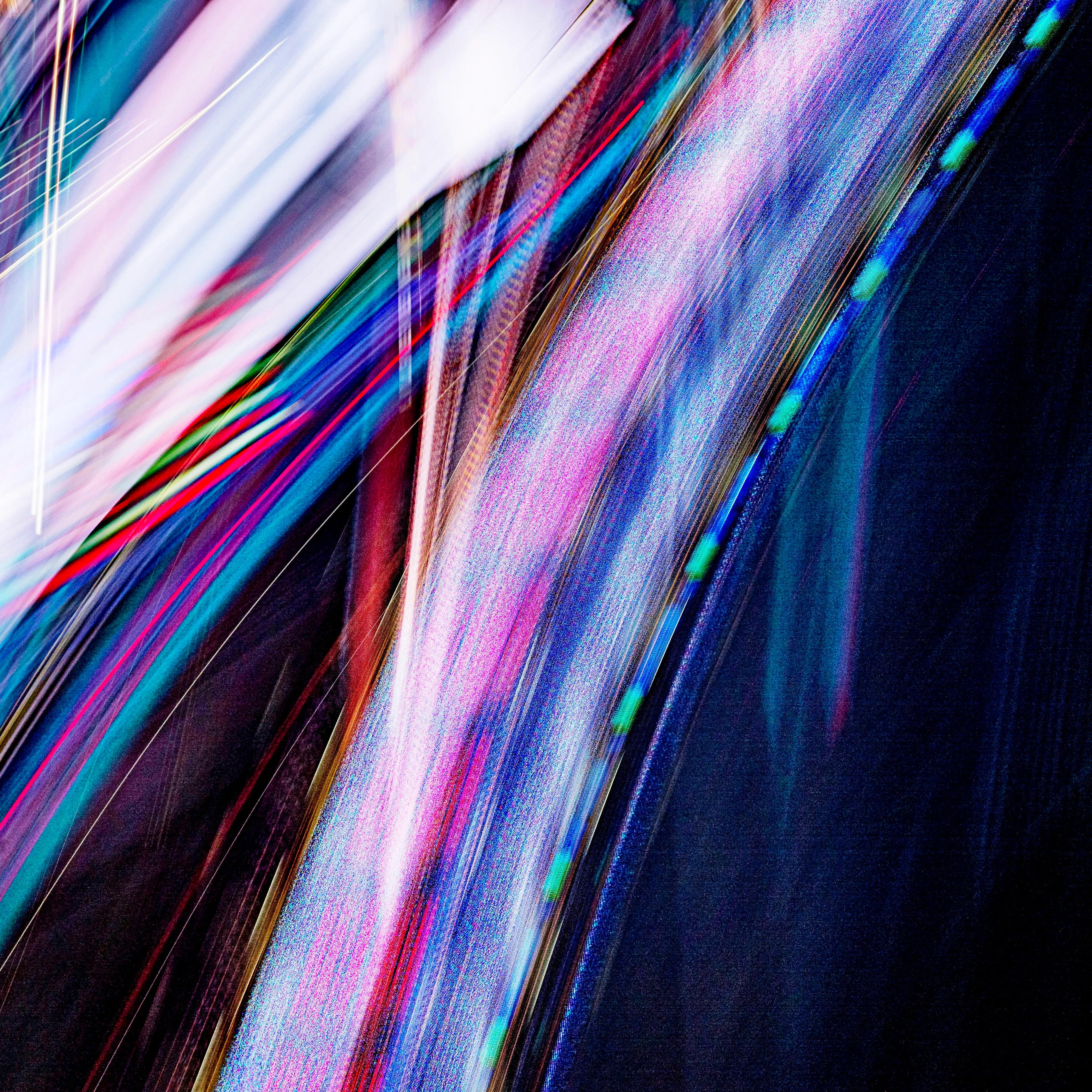 The Transmission of Light series is exposed by the waves of phosphorus, neon, and the light-emitting diodes that are found within NYC advertisements. Resulting photographs create a colorful textural mapping of their unique wave emissions. With my fluid control of axis, focus, time, and position I have been able to analyze the most stunning displays of light. These lights are textural in their glow and unique in their spectrum. In tandem, they communicate a symphony of experience through color & textures not usually captured within a photographic image. As the development of complex AI & generative processes become stronger, I have found my own invaluable strengths of analyzation through defining and testing the variables between the camera & subject.   The markings and trajectory of the light emissions create a unique imprint within their capture & location, therefore, one of a kind at inception, containing various spectrums resonant to the most elaborate of avian feathers.