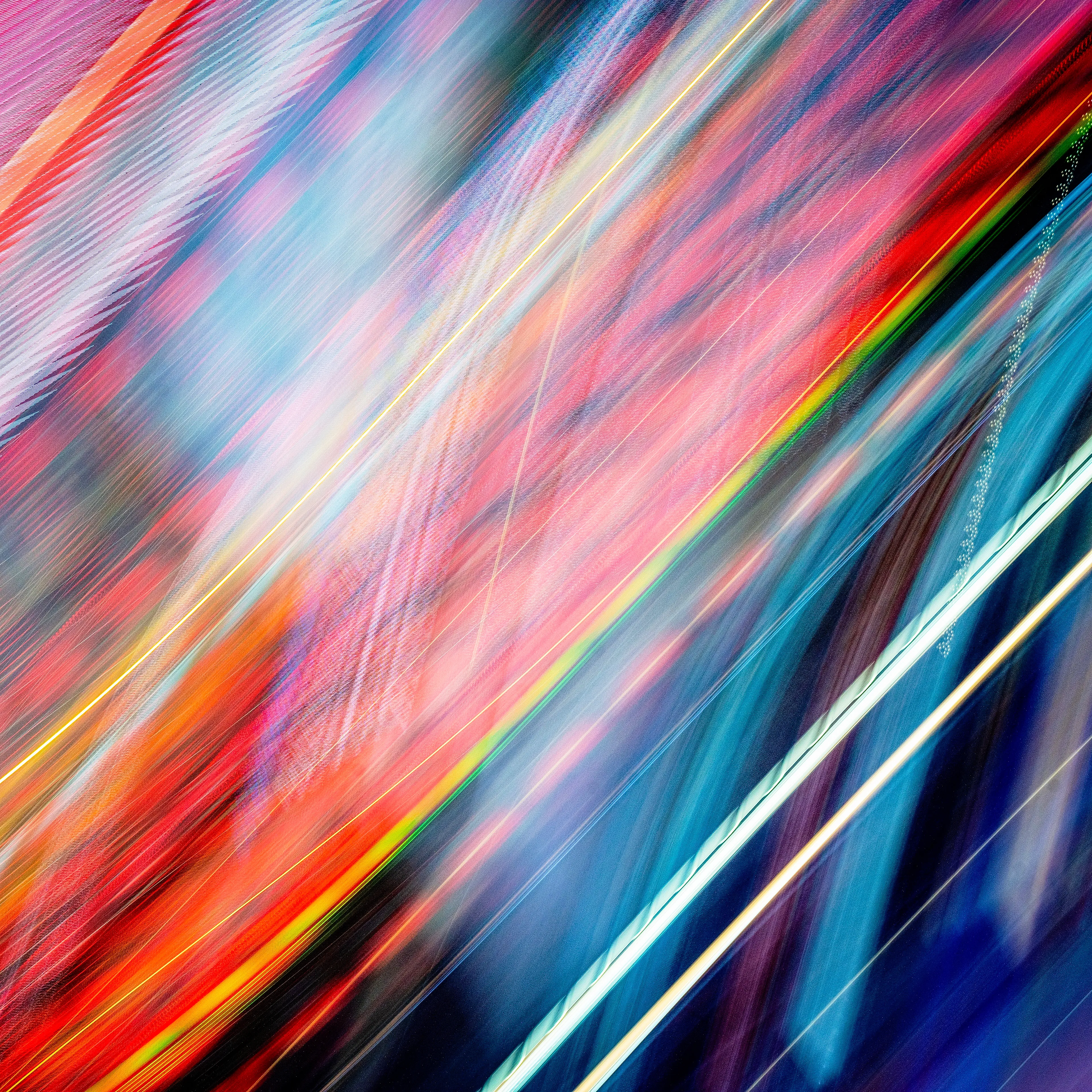 As the development of complex AI & generative processes become stronger, I have found my own invaluable strengths of analyzation through queries of variables defining the language between the camera & subject.  The Transmission of Light series is exposed by the waves of phosphorus, neon, and the light-emitting diodes that are found within NYC advertisements.  Resulting photographs create a colorful textural mapping of their unique wave emissions.  With my fluid control of axis, focus, time, and position I have been able to analyze the most stunning displays of light. These lights are textural in their glow and unique in their spectrum.  In tandem, they communicate a symphony of experience through color & textures not usually captured within a photographic image. The markings and trajectory of these emissions create a unique imprint within their capture & location, therefore, one of a kind at inception, containing various spectrums resonant to the most elaborate of avian feathers.