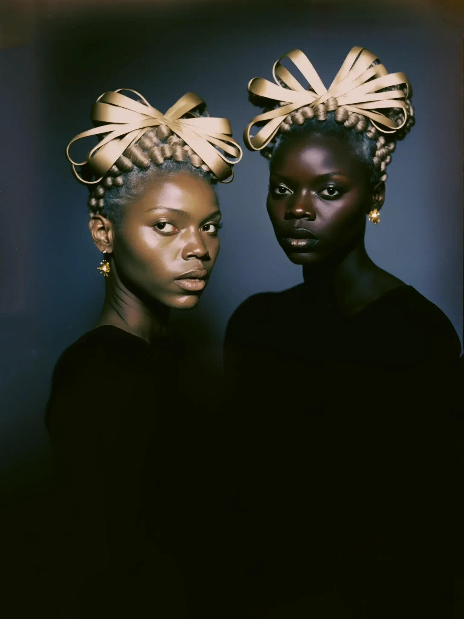 “In ‘Blonde Braids Study II,’ I examine the ways in which a text-to-image algorithm — Midjourney (v4) — renders a portrait of Black identical twins adorned with blonde braids. The resulting image underscores significant gaps in the training data, which inevitably precipitates a flattened representation of the Black identity outlined in the text prompt. Instead, the algorithm generates an interpretation that evokes the semblance of fraternal twins, their hair styled in blonde, permed waves.” — Minne Atairu