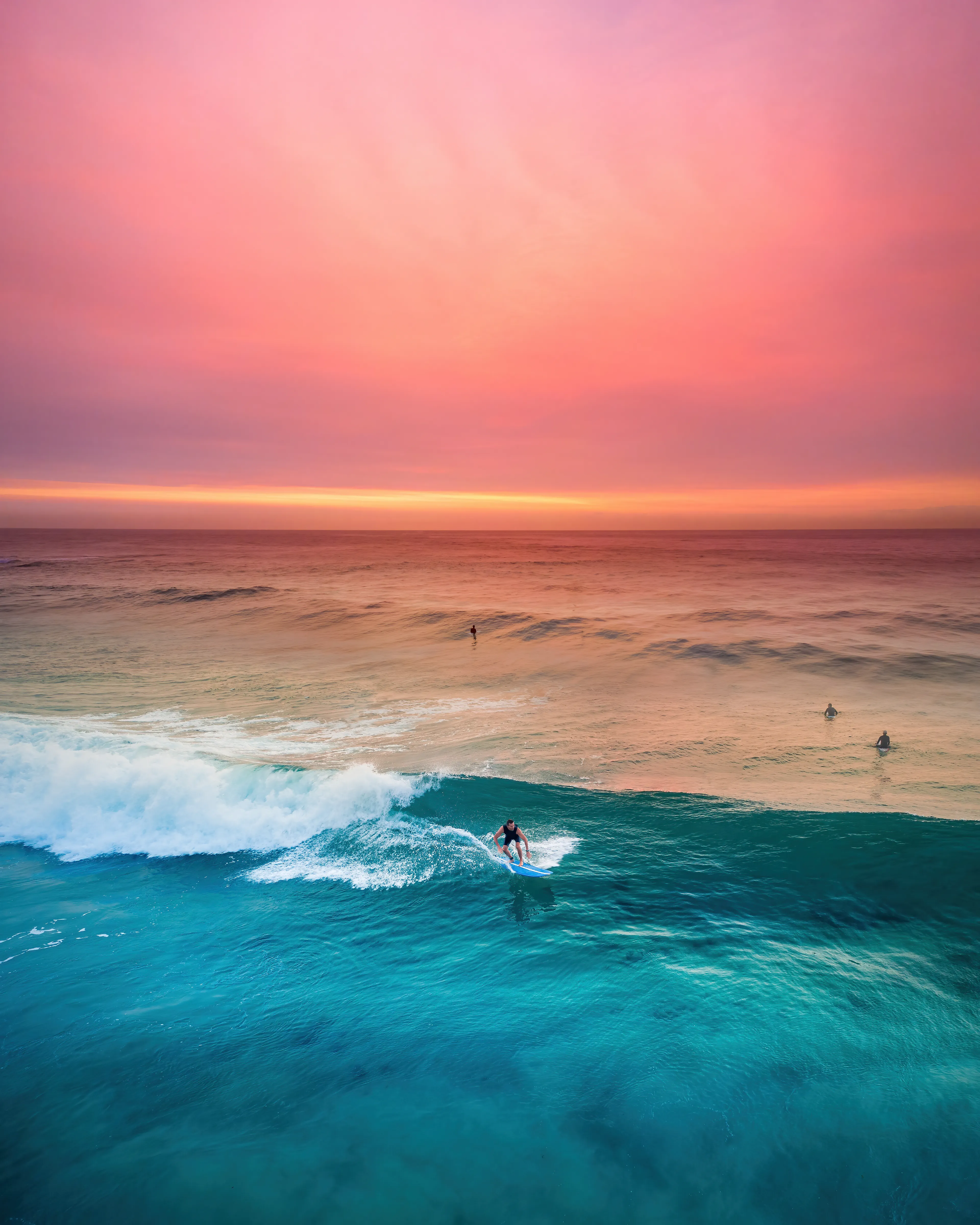 Another favorite image I captured during the smokey bushfire days of 2019 that went viral on social media. The world watched in horror as our country seemed to be burning across the entire continent. I received messages from friends around the world asking if my family and I were safe. It was a surreal time.

The combination of colours was like a natural split-tone effect. The sky was ablaze with fiery reds, oranges, and pinks, and the deep blues and aqua tones of the sea. Sunrises will never look the same as they did during those months, and I hope they never will again.

Artist: David Fairs | New Light Visuals

Title: Hazy Daze

Edition: 1/1