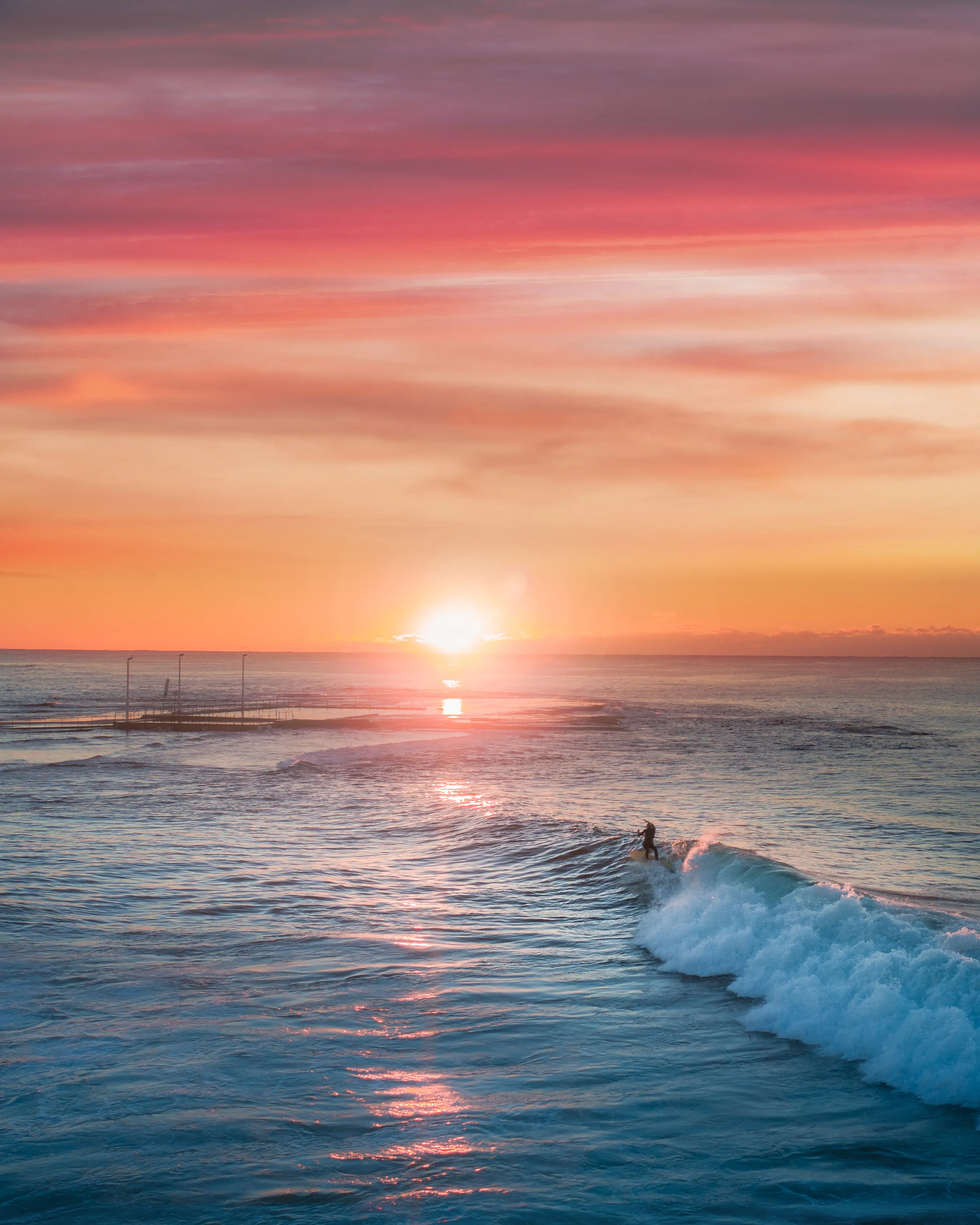 Witnessing surfing with style is one thing but when you combine it with an incredible sunrise, magic happens. I am forever searching for these conditions. The shapes, colours and sun flare bouncing off the water centre frame is my idea of perfection.

Artist: New Light Visuals

Title: Style Rise

Edition: 1/1