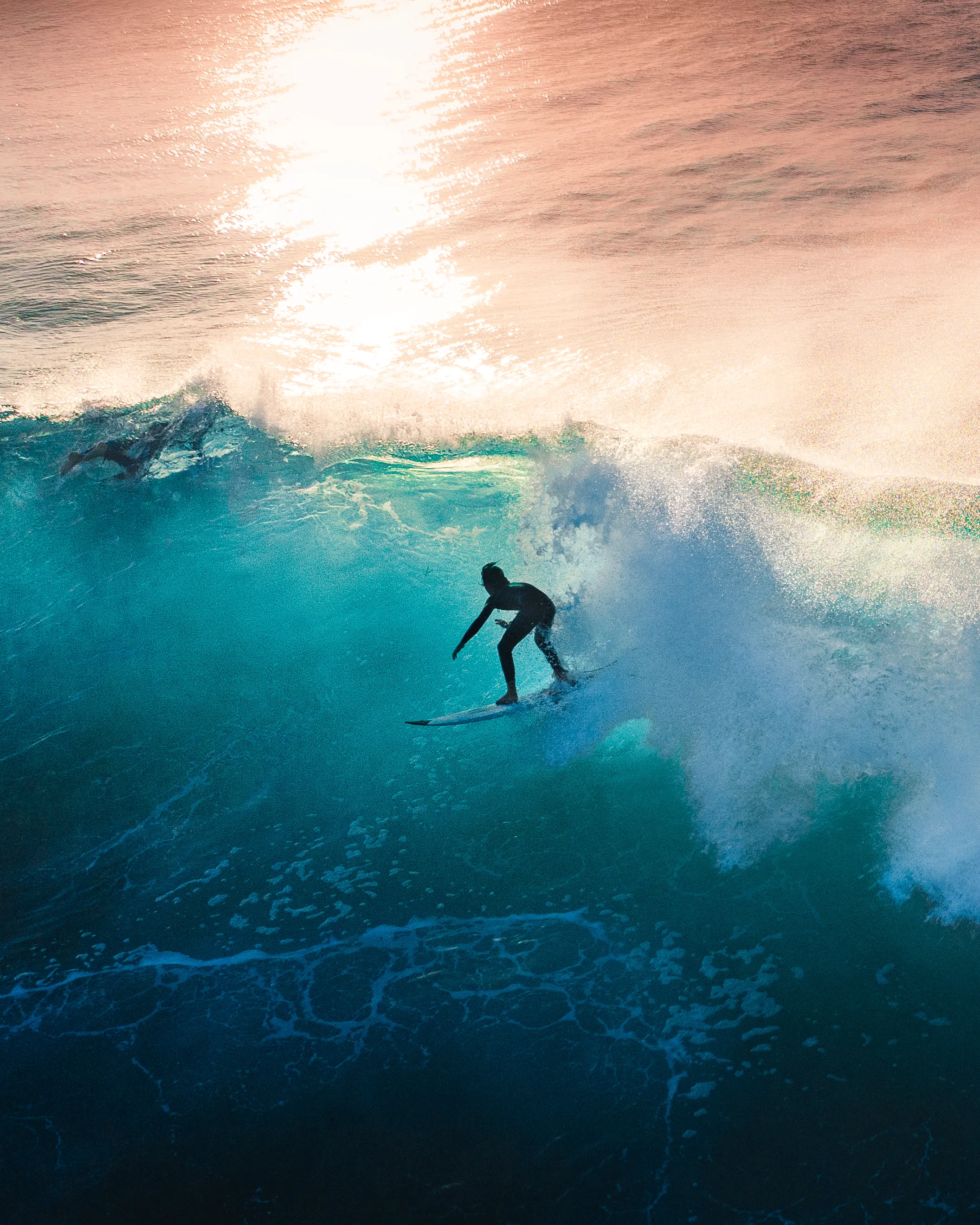 Shooting at sunrise is tricky. It takes a lot of trial and error to shoot surfers in harsh direct light. Choosing the right angle to shoot from and the best height from the air is something I am proud to say I have made one of my signature styles. Getting the right amount of light shining through a wave can make magic.

Artist: New Light Visuals

Title: Gleaming Cubes

Edition: 1/1